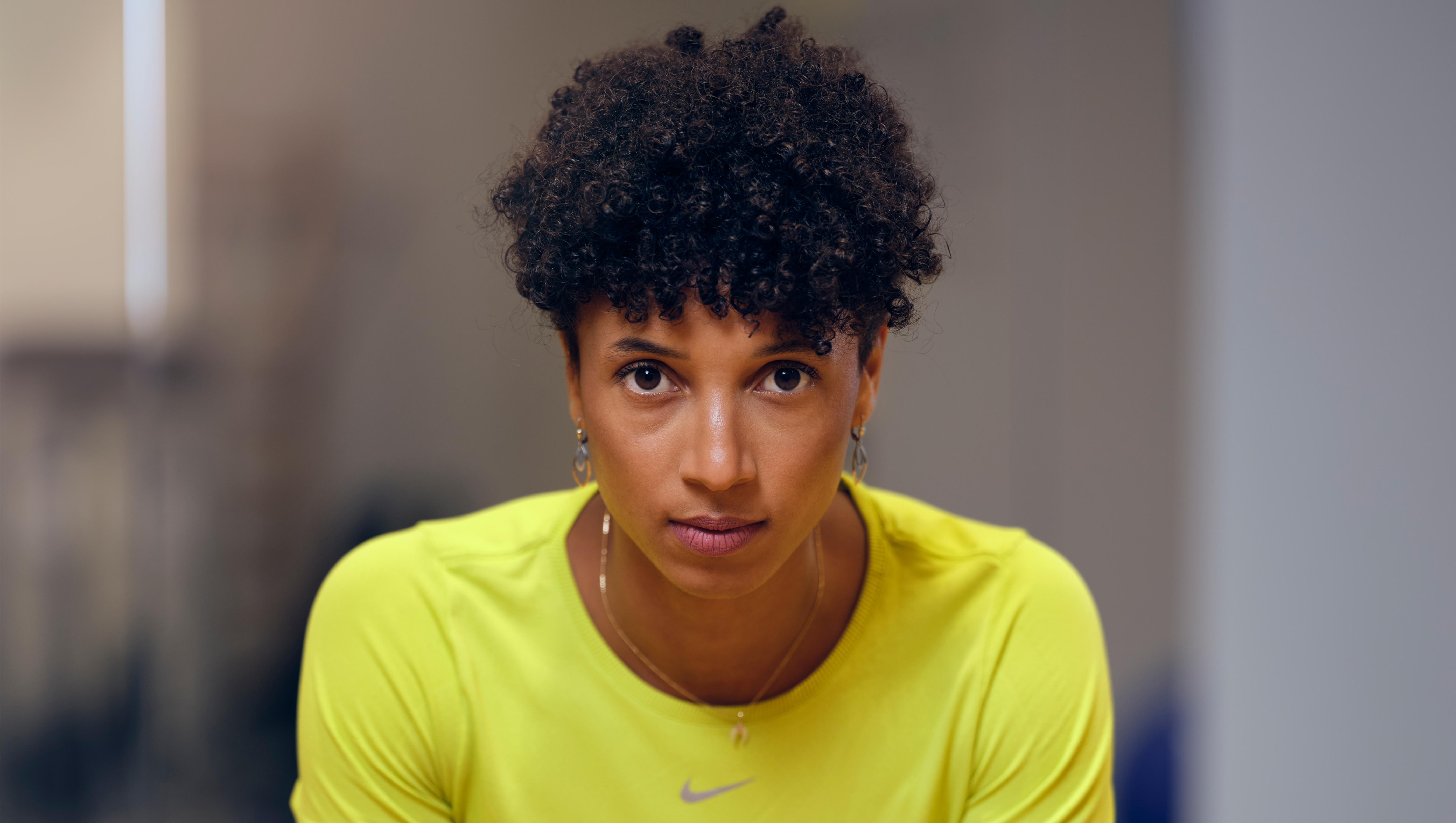 Farmer holds in hands wooden box with vegetables produce in garden. Fresh and organic food.